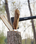 14 Inch Camping Hatchet With Carbon Steel Blade And Do It All Sheath splitting wood outdoors.
