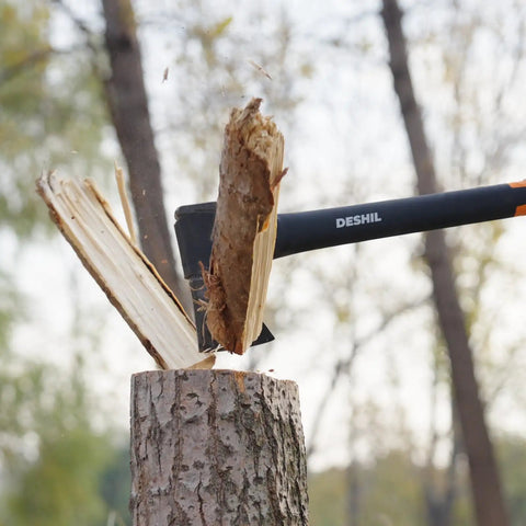 14 Inch Camping Hatchet With Carbon Steel Blade And Do It All Sheath splitting wood outdoors.
