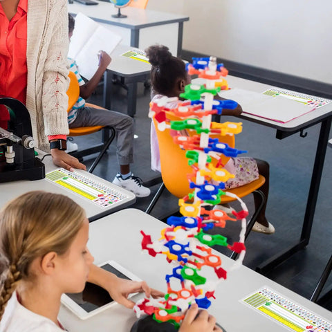 Classroom desks with Stick On Nameplate Pockets For Desks, 40 Pack, Clear Adhesive Covers Measuring 4.7 X 14.2 Inches in use