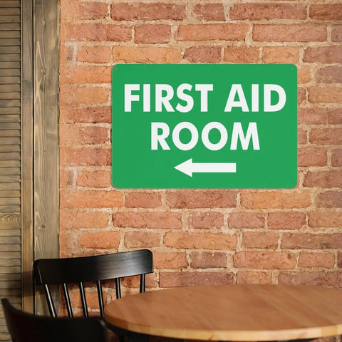 Left Arrow First Aid Room Outdoor Medical Safety Sign 8x12 Aluminum Wall Decor on brick wall.