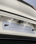 Close-up of aluminum frame securing car license plate with Spikes License Plate Screws Set With Aluminum Frame Fasteners, Anti Theft Kit.