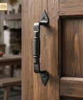 Mystic Colonial Rustic Cast Iron Barn Door Handles Set Of 2 In Black Finish installed on a wooden door