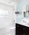 Ultra Quiet Ceiling Bathroom Exhaust Fan 50 CFM White Mount, 1 Sone, installed in a modern bathroom with white tiles and bathtub.