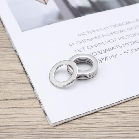 30Pcs Flat Washers 304 Stainless Steel 10x16x1mm Door Hinge Gaskets on a surface, silver finish
