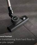 Premium Bagged Canister Vacuum For Hard Floors And Thin Carpet Featuring XL Parquet Brush Universal Floorhead Footswitch Hygienic Air Filter For Badass Suction And Slick Cleanup on tiled surface.
