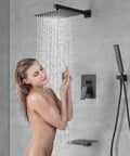 Badass Matte Black Waterfall Bathtub Faucet Set With Handheld Shower in use, stainless steel spout and brass wand visible