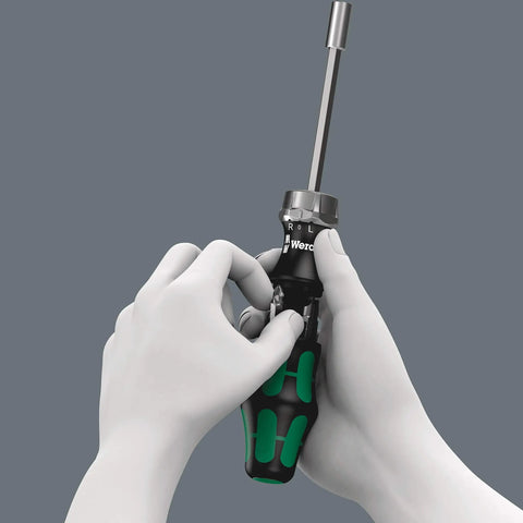 Ratcheting 7 Pc Screwdriver Set With 1 Quarter Inch Drive, Fine Tooth Ratchet, shown held in hands demonstrating switchover ring use.