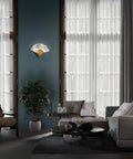 Solid 17 Inch LED Wall Sconce With Smooth Dimming And Warm 3000K Glow In Antique Nickel Finish illuminating a modern living room.