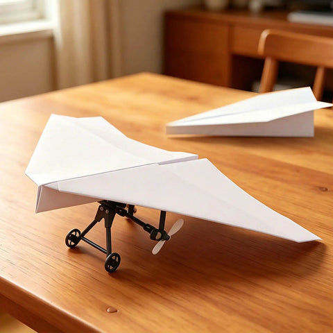 Electric Remote Control Paper Airplane Kit With Stabilizer And Dual Propellers on wooden table, foldable wings visible