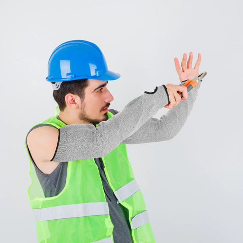 Industrial Grade White Cut Resistant Arm Sleeves Pro Level Forearm Protection For Welding Meat Processing And Auto Repair Tough As Nails Pe Guard Cover Set For Men And Women worn by a worker in a blue hard hat and green vest.