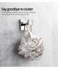 Premium Stainless Steel Heavy Duty Towel Hook Wall Mounted robe hook holding a shower pouf on a concrete wall.