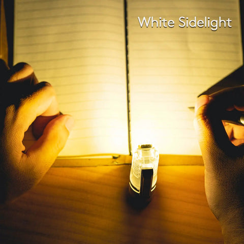 A28 Gen 2 Pocket Flashlight 1000 Lumen USB C Rechargeable providing light on open notebook, hands beside.