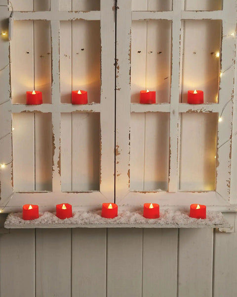 Red LED Tea Lights Battery Operated Flameless Candles, 200 Hours Of Flickering Safe Fake Candles For Party Vibes on a window sill.