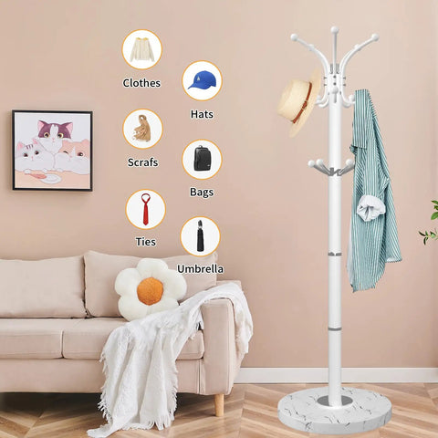 Sleek Freestanding Coat Rack With 360 Degree Swivel Hooks And Marble Base in a living room setting with clothes displayed.