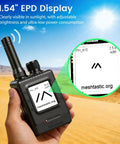 Person holding ThinkNode M1 LoRa Meshtastic Transceiver with GPS and 1.54 inch EPD screen in desert landscape.