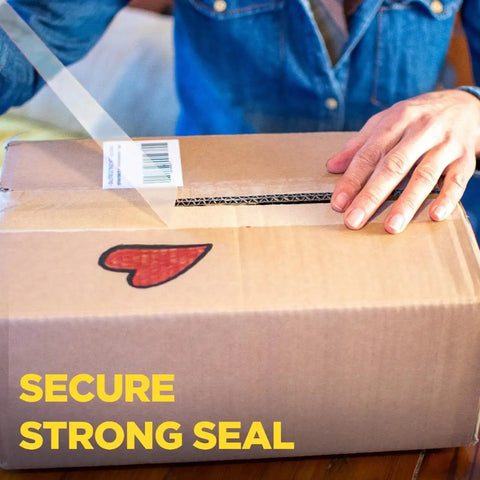 Hand sealing a box with Ultra Clear Packing Tape With Dispensers For A Tight Seal, Heavy Duty, Moisture And Dust Resistant, 1.88 In By 800 In