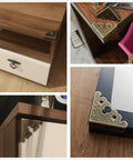 Four Pack Slick Antique Bronze Corner Protectors Heavy Duty Zinc Alloy Edge Guards For Furniture Tables And Wooden Boxes on table edges.