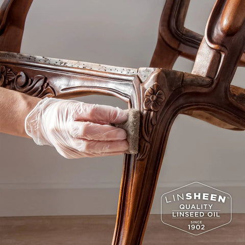 Applying Fast Drying Boiled Linseed Oil For Wood Restoration And Protection Pro Grade Formula on carved wooden furniture