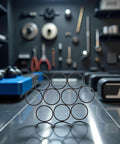 Ten Pack Black Disk Drive Rubber Belts Replacement Kit For Xbox 360 And Rock Tumblers on workbench in workshop