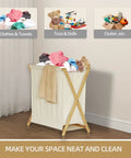 Collapsible Bamboo Wood Laundry Hamper With X Frame Foldable Laundry Basket And Linen Canvas Bag in bedroom corner.