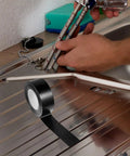 Waterproof Heavy Duty Duct Tape 50Mm By 50M Rubberized Sealing Tape for leak repair near kitchen sink with plumbing tools.
