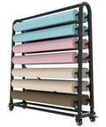 Heavy Duty Fabric Roll Storage Rack With Adjustable Hanging Rod And Movable Steel Organizer For Coils Wraps Craft Supplies displaying rolled materials.