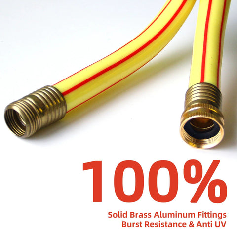 Close-up of yellow garden hose with brass fittings and red stripe