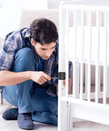 Man installing Heavy Duty L Brackets And Corner Connectors For Woodwork on a crib in a living room setting.