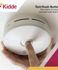 Close-up of 2-In-1 Smoke And Carbon Monoxide Detector Combo With 10 Year Battery installed, featuring test-hush button.