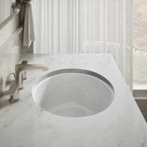 Undermount Single Bowl Bath Sink With Sealed Overflow In White Vitreous China, Durable Under Counter Design installed in marble countertop
