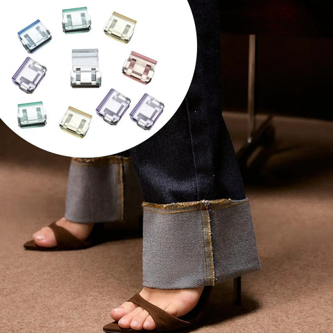 Set Of 10 Invisible Hem Clips For Pants No Sew Quick Fix Pants Hem Shortening Clips Mixed Color Easy To Use Inner Side Design Keeps Cuffs Off The Ground, shown next to jeans with shortened cuffs.