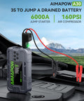 Beast Portable Car Jump Starter With Air Compressor 6000A next to open car hood, red and black cables connected, outdoors.