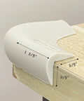 Butter Smooth And Kid Tough Food Grade Silicone Corner Protectors For Baby Proofing Couch And Table Edges on a table corner with measurements.