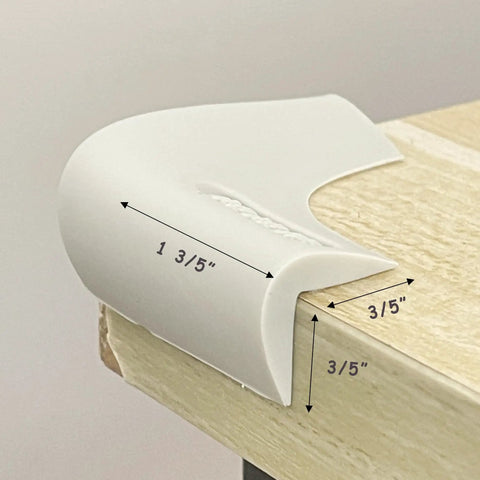 Butter Smooth And Kid Tough Food Grade Silicone Corner Protectors For Baby Proofing Couch And Table Edges on a table corner with measurements.