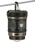 Siege AA 200-Lumen Lantern With White And Red LEDs For Camping And Emergencies hanging on wire, compact coyote design
