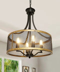 Four Light Farmhouse Drum Chandelier With Adjustable Height Finish In Antique Gold And Matte Black Industrial Pendant Lighting For Dining Room Kitchen Living Room showing metal mesh drum shade with lit bulbs.