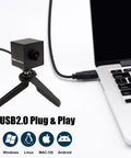 5MP USB Camera Module With Autofocus And 30FPS Wide 138 Degree Field Of View IMX335 Sensor Low Light Performance For Industrial Machine Vision UVC Plug And Play Compatibility With Windows MacOS Linux Android connected to laptop on table