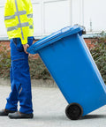 Person using Garbage Can Wheels Replacement With Metal Hollow Shaft And Small Rubber Wheels 19.68 X 7.28 X 3.93 Inches on blue bin
