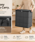 Big Roomy Fabric Storage Tote With Smooth Dual Zipper Foldable Closet Organizer For Quilts Bedding Moving Seasonal Coats, shown being carried.