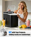 Woman using black ice maker on kitchen counter with fruit, drinks, and 1/2 Inch Small Caster Wheels With 360 Swivel Low Profile Silent Rubber Casters visible