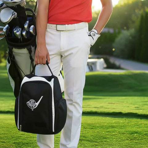 Person holding Personalized Golf Shoe Bag For Men And Women With Custom Monogram And Embroidered Initials on golf course.