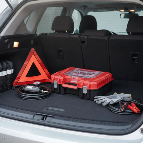 Red and black Grab-And-Go Portable Plastic Tool Box With Handle For Hardware Storage, in a car trunk, compact 11.8 x 10.2 x 3.9 inches.