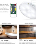 Wireless Motion Sensor LED Closet Lights With Remote USB Rechargeable Puck Lights showing remote control and sensor features.