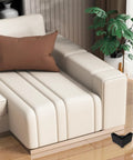 Heavy Duty 4 Pack Adjustable Plastic L Shaped Furniture Legs With M5 Screws next to a sofa on wooden flooring.