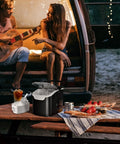 Antarctic Star black countertop ice maker with clear lid; 2-piece set includes white ice basket and scoop.