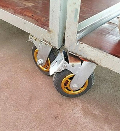 Heavy Duty Rubber Swivel Casters With Zero Drag Brakes Dang Smooth Rolling Industrial Platform Wheels on a cart, showcasing gold wheels.