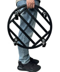 Person holding 18 Inch Round Plant Caddy With Wheels Heavy Duty Metal Plant Dolly for indoor outdoor use