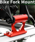 Close-up of red quick release fork mount from 2023 Upgraded Quick Release Thru Axle Bicycle Fork Rack Block with four adapters.