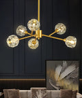 Gold Sputnik Crystal Chandelier, 6 Light Modern Dining Room Fixture Over Table in brass finish, sparkling spherical orbs