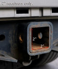 Close-up of a 2-inch trailer hitch receiver on a vehicle, suitable for 2 Inch Trailer Hitch Cover Plug With Metal American Black Flag Universal Fit